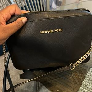 Black crossbody Michael Kors purse. Perfect condition